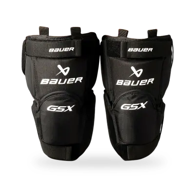 Bauer GSX Goalie Knee Guard showing anatomical hard cap shell and dual neoprene straps, front view on white background.
